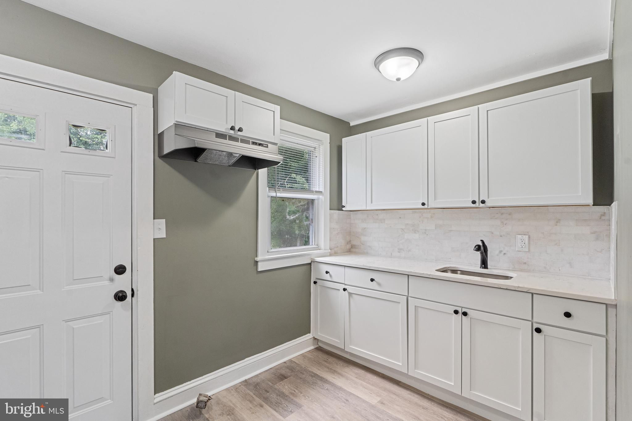 22 Davis Avenue Salem, NJ 08079 - Photo 8 of 25 a kitchen with a sink and cabinets