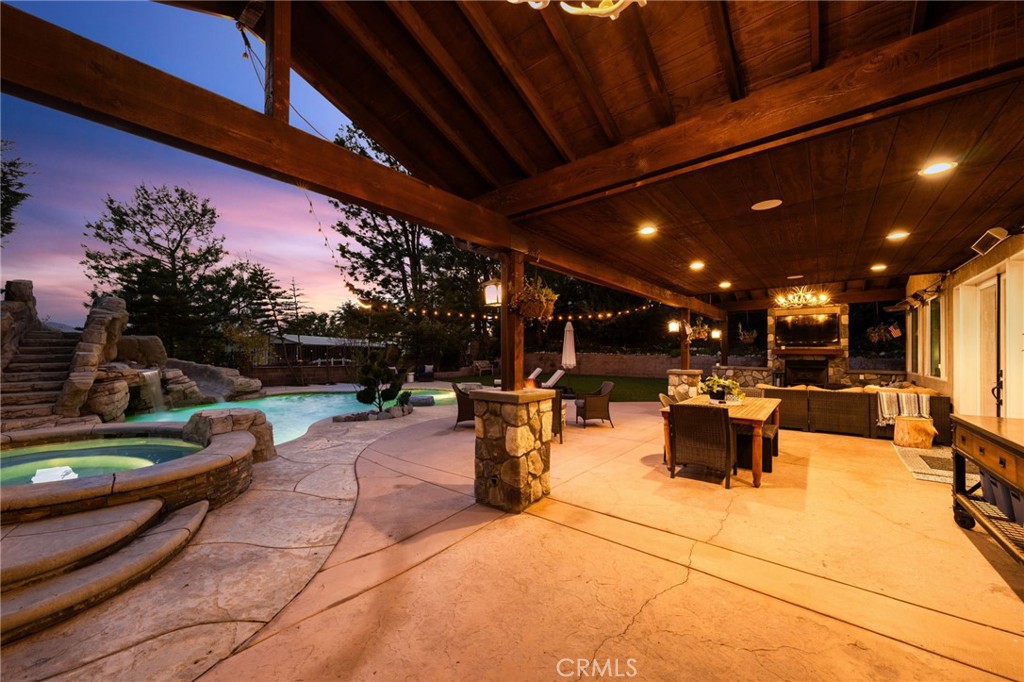 12739 East Rancho Estates Place Rancho Cucamonga, CA 91739 - Photo 1 of 1 a view of a patio with dining table and chairs with wooden fence