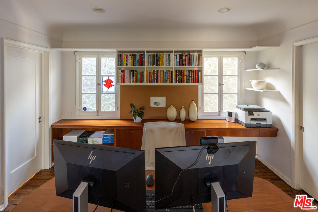 10346 Rochester Avenue Los Angeles, CA 90024 - Photo 11 of 19 a living room with furniture a dining table and a bookshelf