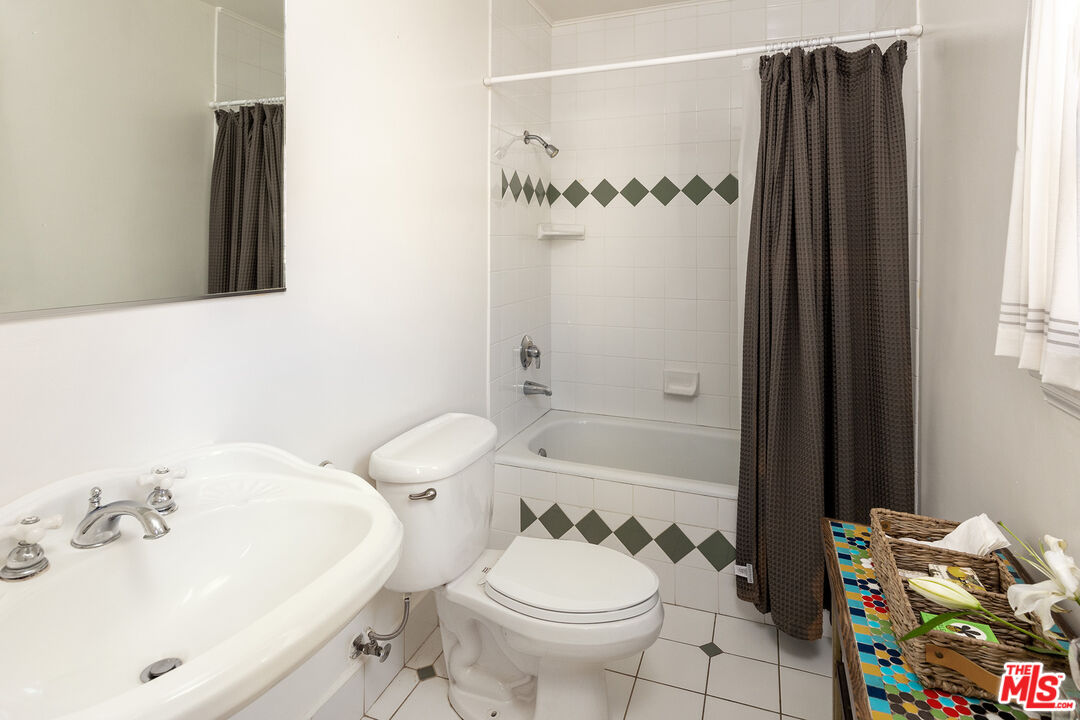 10346 Rochester Avenue Los Angeles, CA 90024 - Photo 13 of 19 a bathroom with a sink toilet and shower