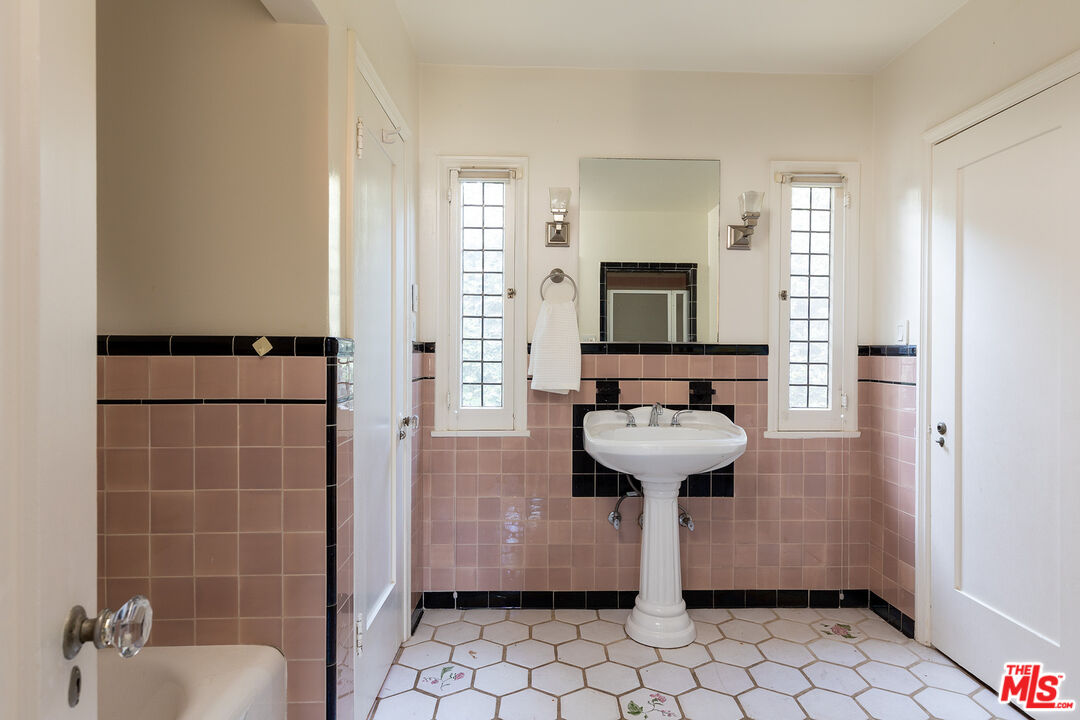 10346 Rochester Avenue Los Angeles, CA 90024 - Photo 14 of 19 a bathroom with a sink toilet and shower