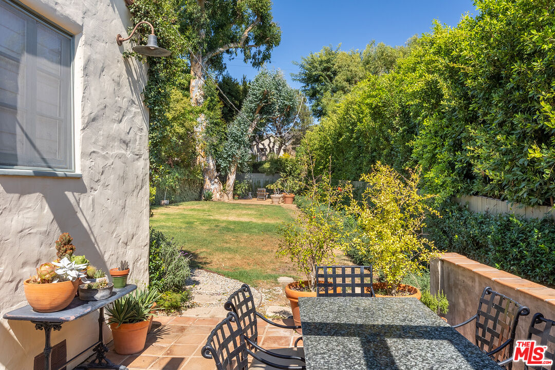 10346 Rochester Avenue Los Angeles, CA 90024 - Photo 17 of 19 a view of a patio with table and chairs and potted plants