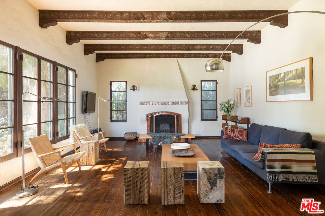 10346 Rochester Avenue Los Angeles, CA 90024 - Photo 4 of 19 a living room with furniture and a fireplace