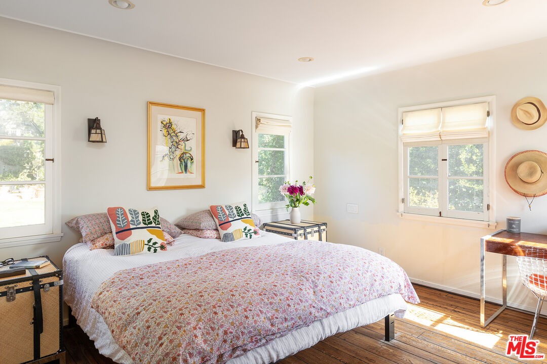 10346 Rochester Avenue Los Angeles, CA 90024 - Photo 9 of 19 a bedroom with a bed and wooden floor