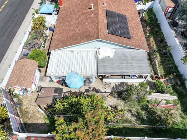 an aerial view of a house with outdoor space