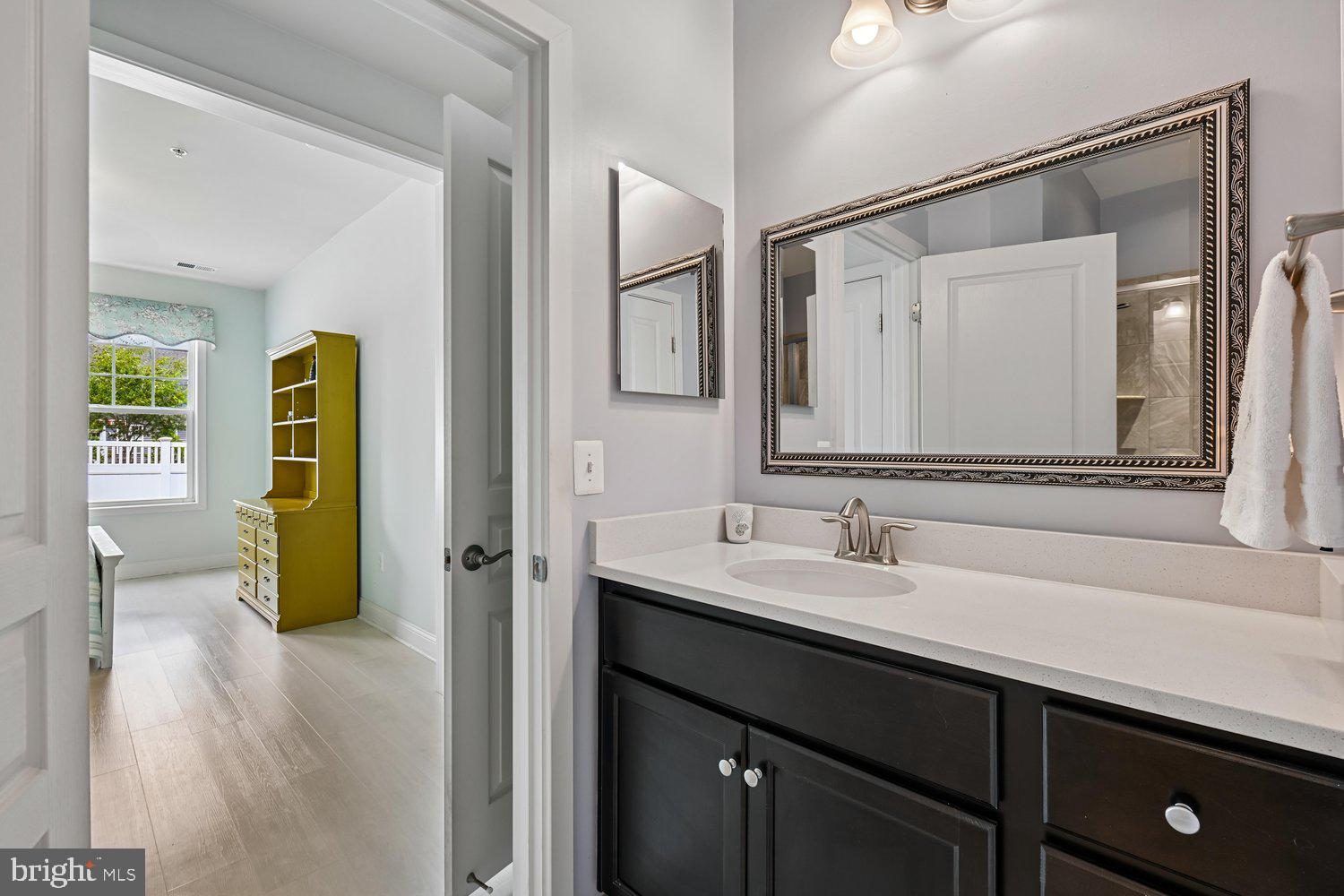 3068 Spring Peeper Court Odenton, MD 21113 - Photo 10 of 42 a en suite bathroom with a sink and a mirror