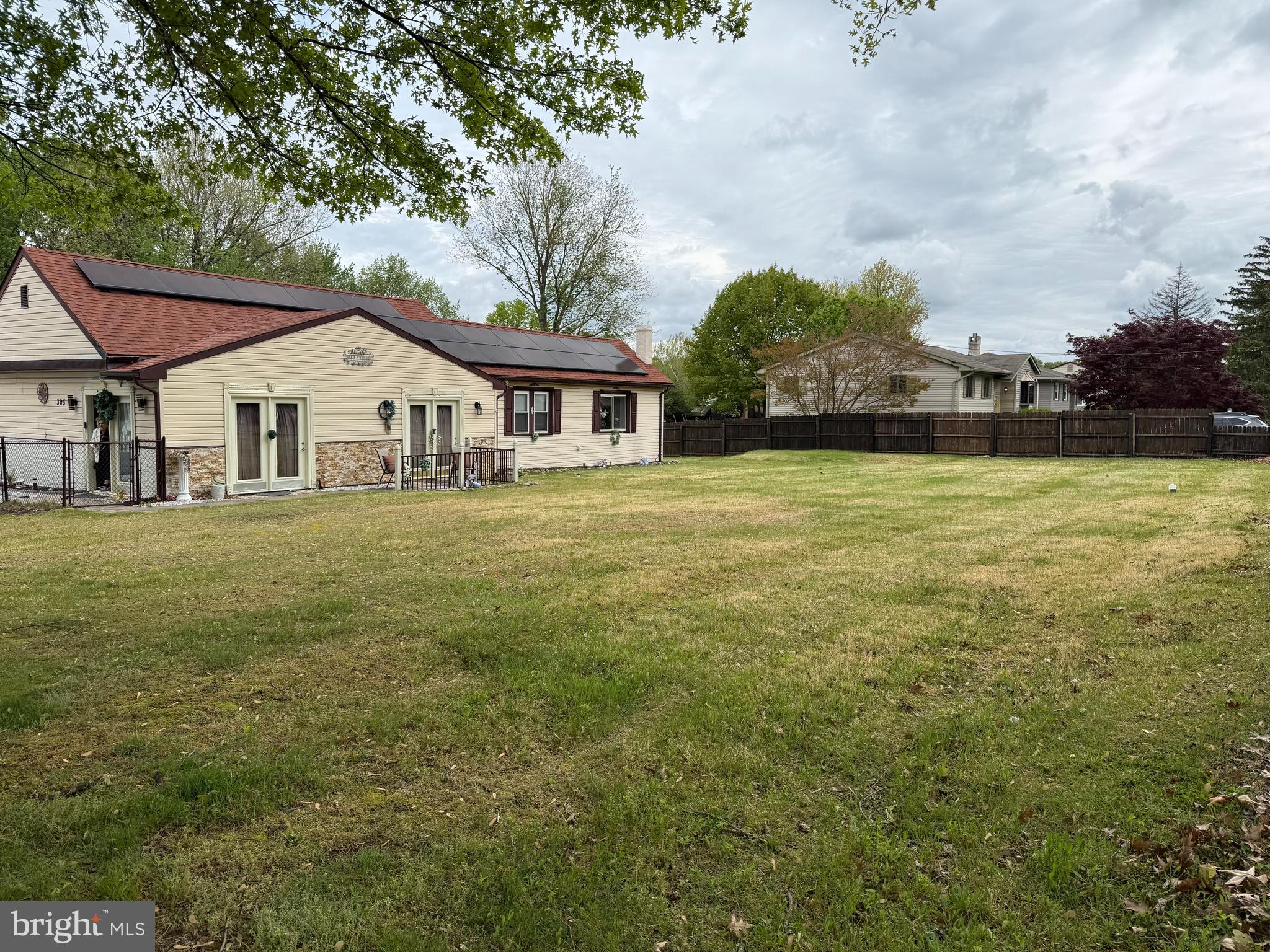 305 Lincoln Avenue Maple Shade, NJ 08052 - Photo 1 of 23 a white house with a big yard and large trees