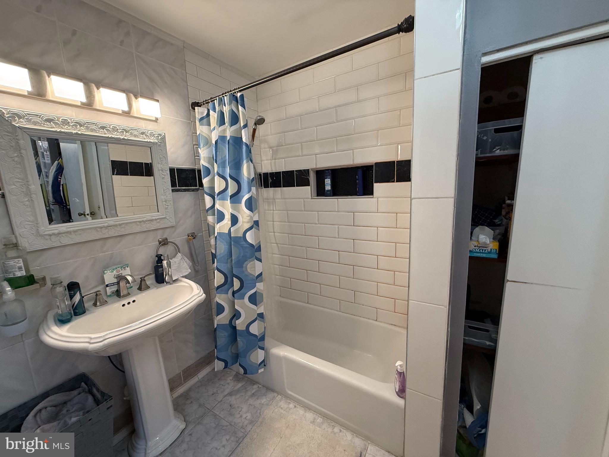 305 Lincoln Avenue Maple Shade, NJ 08052 - Photo 8 of 23 a bathroom with a sink a toilet and shower