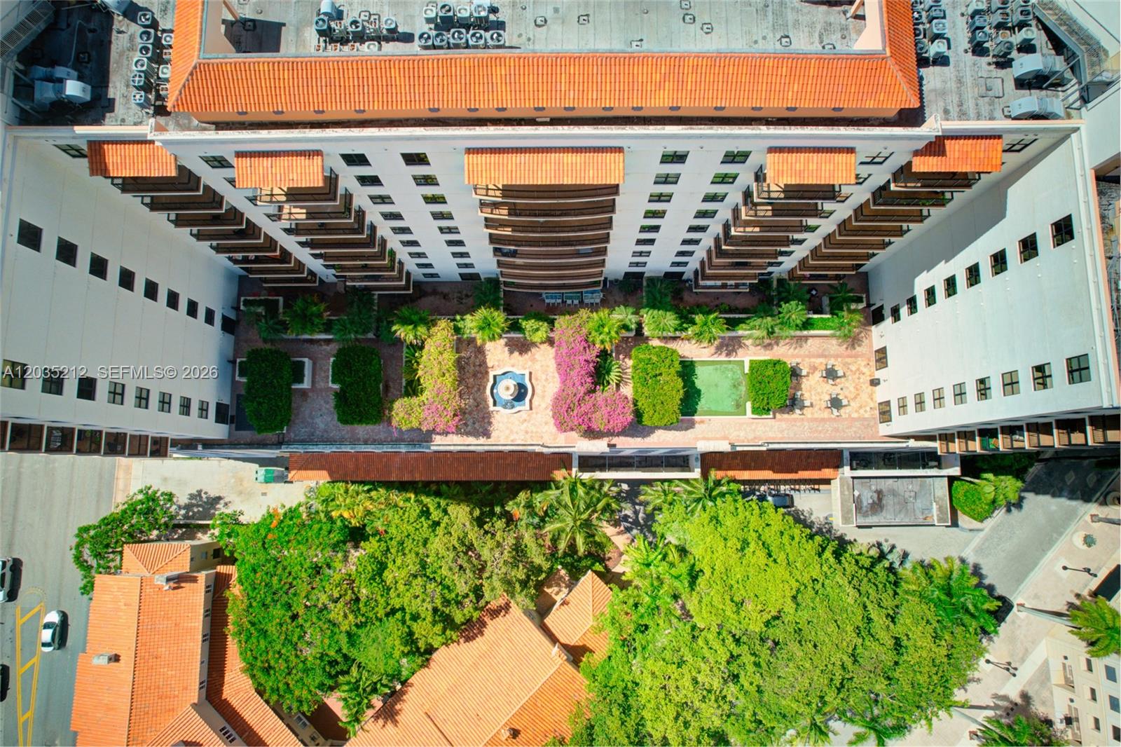 888 Douglas Road, Unit 302 Coral Gables, FL 33134 - Photo 49 of 51 PUERTA DE PALMAS TERRACE, FOUNTAIN AND PUTTING GREEN