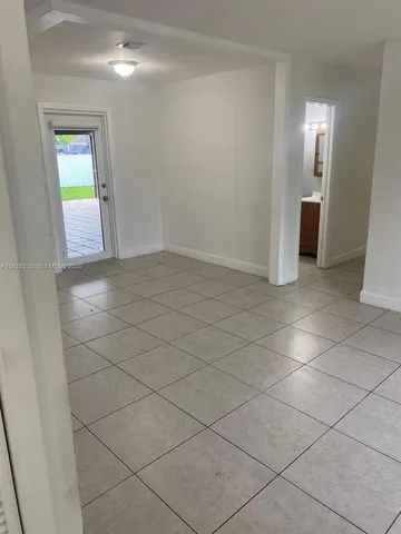 a view of an empty room and window