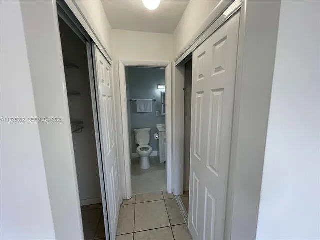 a view of a bathroom from a hallway