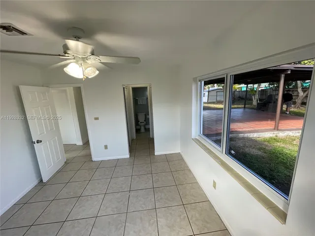 a view of an entryway with a ceiling fan