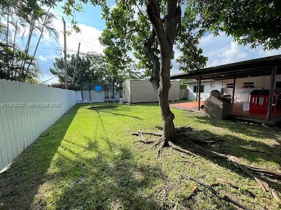 a view of swimming pool with a backyard