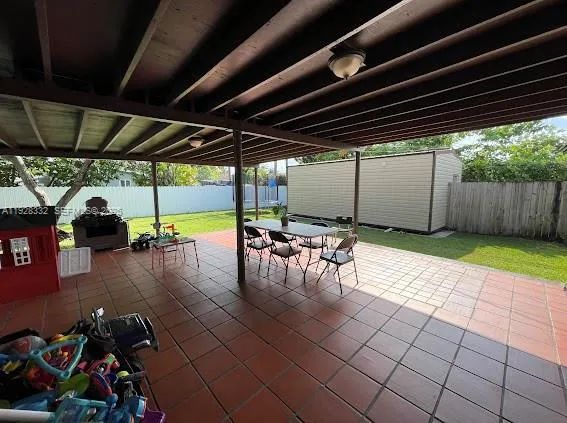a view of a garage with wooden floor