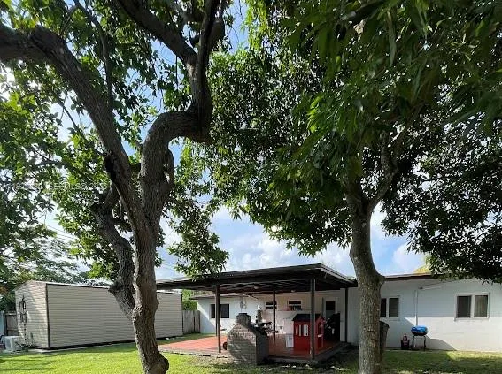 a view of a car park in front of a house