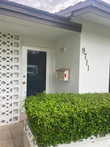 a view of a front door and a window