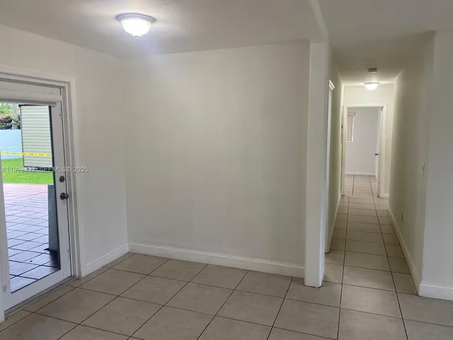 an empty room with entrance and door