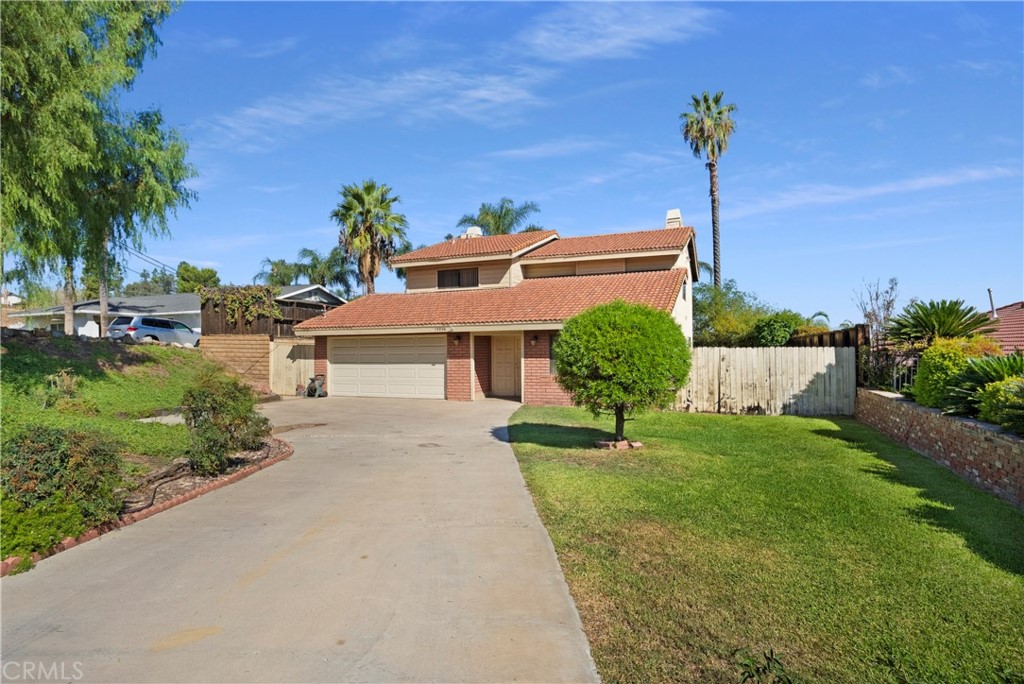 14230 Oakley Drive Riverside, CA 92503 - Photo 1 of 1 a front view of a house with a garden