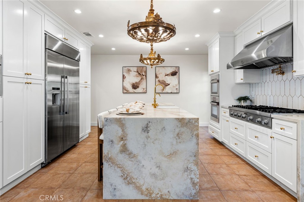 1201 Montecito Drive Montecito Heights, CA 90031 - Photo 24 of 71 a kitchen with stainless steel appliances granite countertop a sink a stove and refrigerator