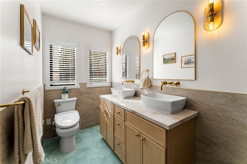 1201 Montecito Drive Montecito Heights, CA 90031 - Photo 31 of 71 a bathroom with a toilet sink and mirror