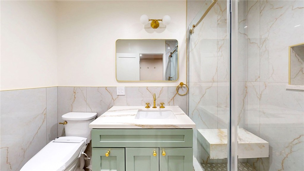 1201 Montecito Drive Montecito Heights, CA 90031 - Photo 66 of 71 a bathroom with a sink a toilet and mirror