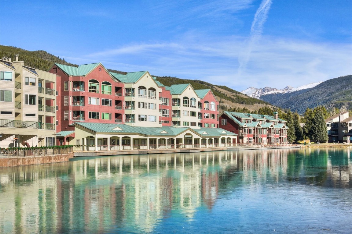 22174 Highway 6, Unit 1527 Keystone, CO 80435 - Photo 20 of 27 a view of a lake with a building in the background