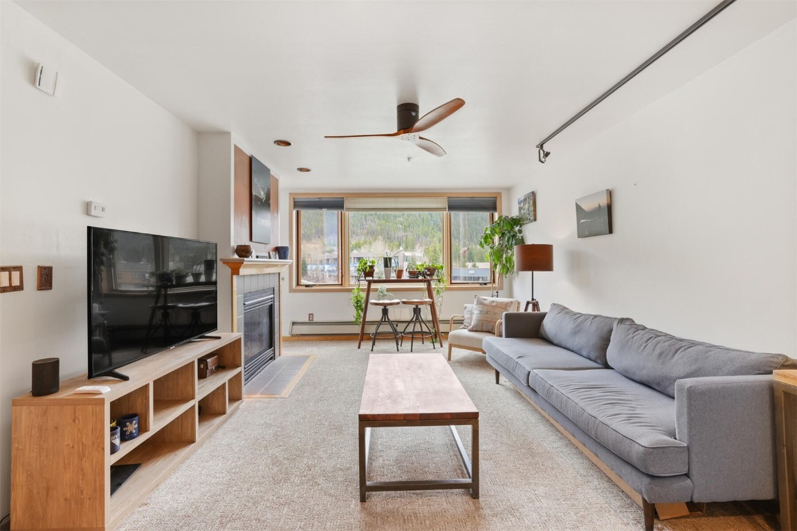 22174 Highway 6, Unit 1527 Keystone, CO 80435 - Photo 2 of 27 a living room with furniture and a flat screen tv