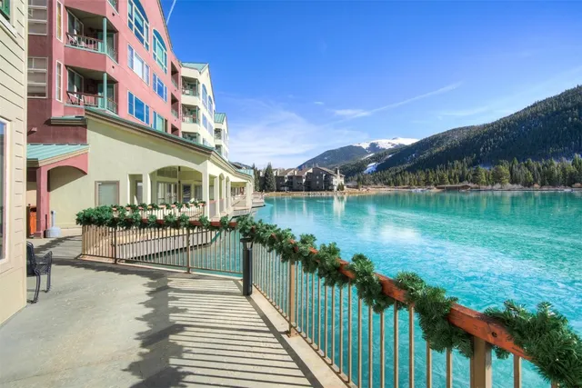 a view of a brick building next to a lake view