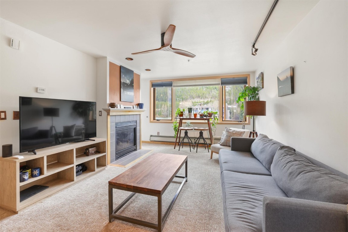 22174 Highway 6, Unit 1527 Keystone, CO 80435 - Photo 4 of 27 a living room with furniture and a flat screen tv