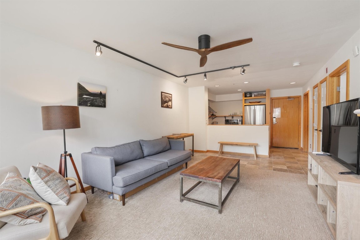 22174 Highway 6, Unit 1527 Keystone, CO 80435 - Photo 5 of 27 a living room with furniture and a flat screen tv