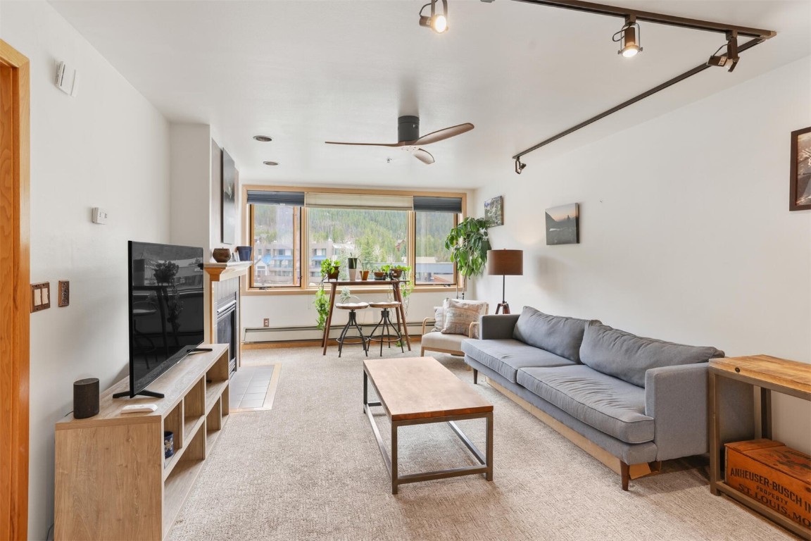 22174 Highway 6, Unit 1527 Keystone, CO 80435 - Photo 8 of 27 a living room with furniture and a flat screen tv