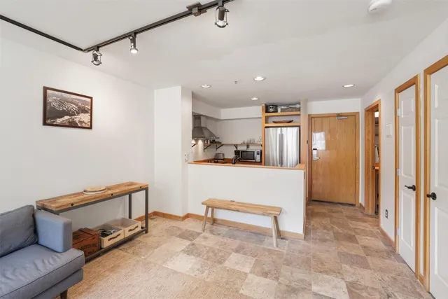 a view of hallway with couch and a rug