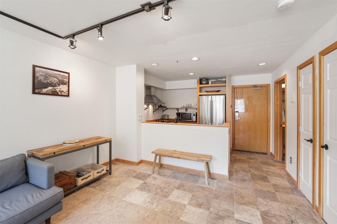 22174 Highway 6, Unit 1527 Keystone, CO 80435 - Photo 9 of 27 a view of hallway with couch and a rug