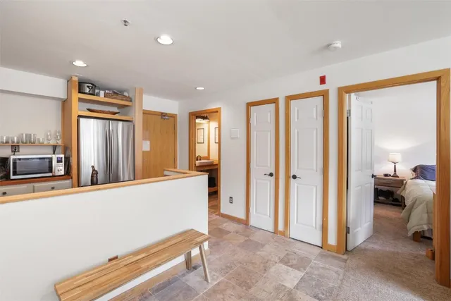 a living room with furniture and a dresser