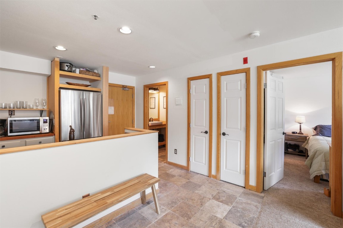 22174 Highway 6, Unit 1527 Keystone, CO 80435 - Photo 10 of 27 a living room with furniture and a dresser