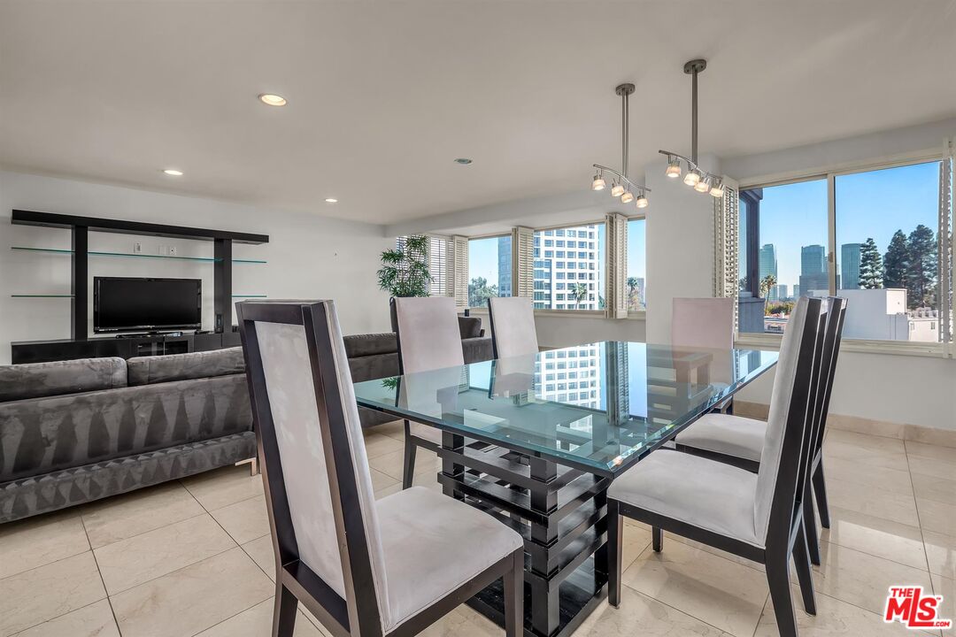 865 Comstock Avenue, Unit 4C Los Angeles, CA 90024 - Photo 14 of 26 a view of a dining room with furniture window and wooden floor