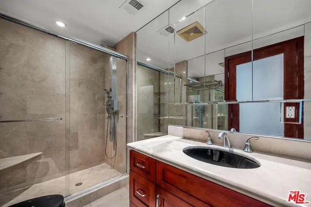a bathroom with a sink and a shower