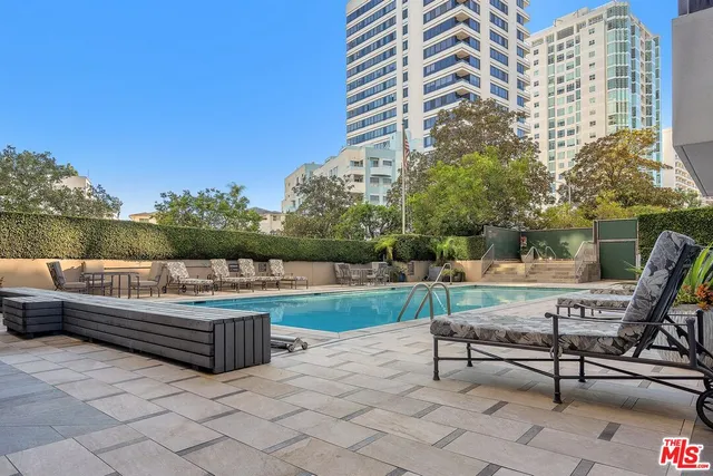 a view of a swimming pool with a lounge chairs