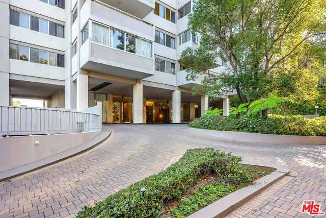 a view of a building with a yard