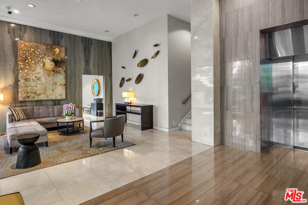 865 Comstock Avenue, Unit 4C Los Angeles, CA 90024 - Photo 4 of 26 a living room with furniture and wooden floor