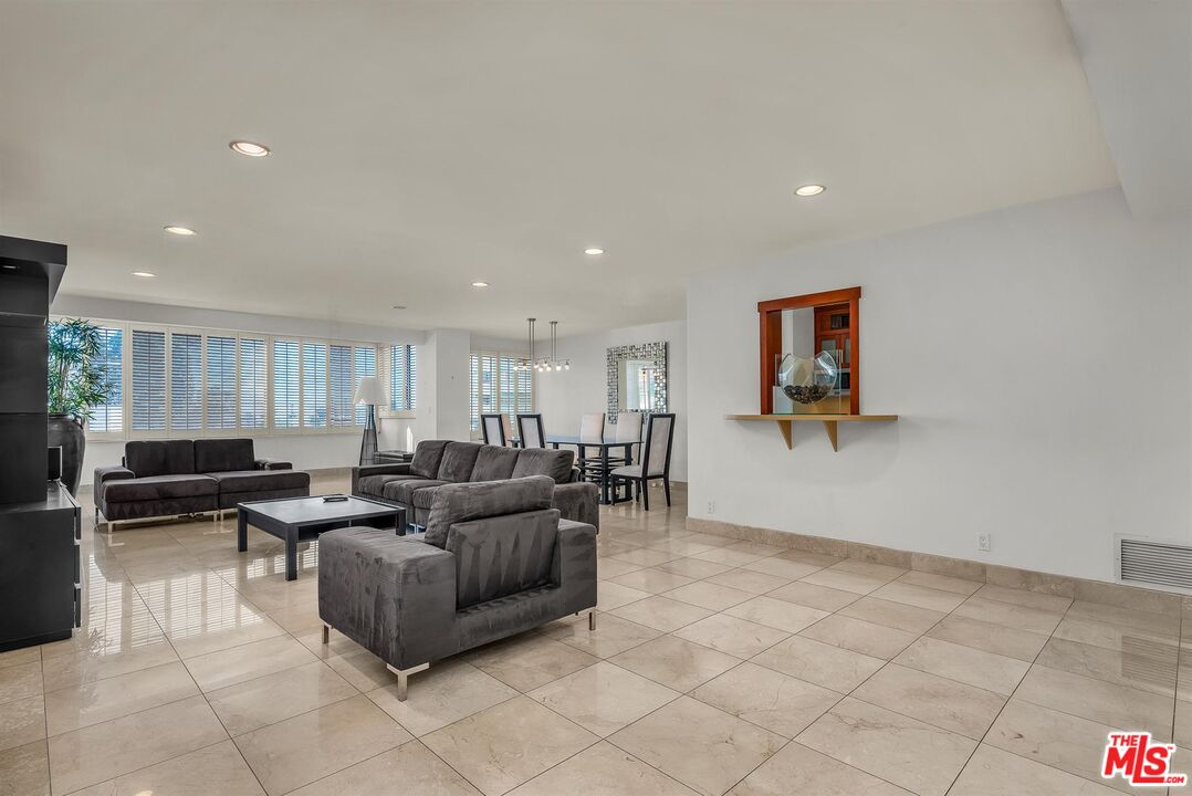 865 Comstock Avenue, Unit 4C Los Angeles, CA 90024 - Photo 7 of 26 a living room with furniture and a window