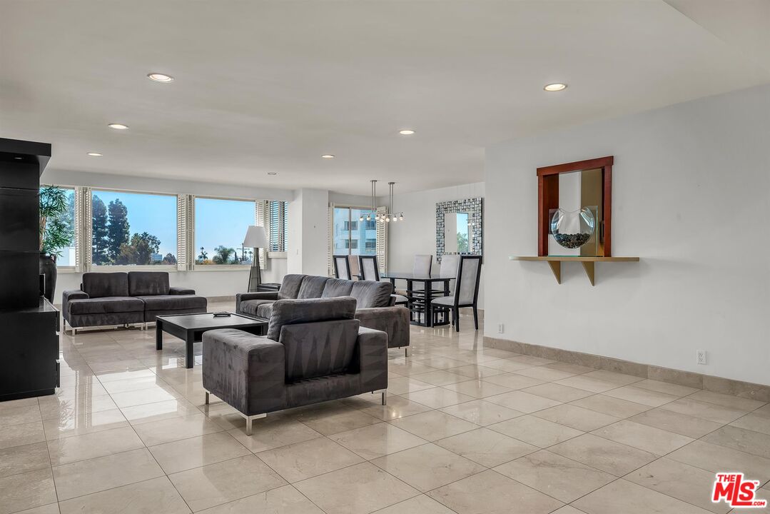 865 Comstock Avenue, Unit 4C Los Angeles, CA 90024 - Photo 8 of 26 a living room with furniture and a window