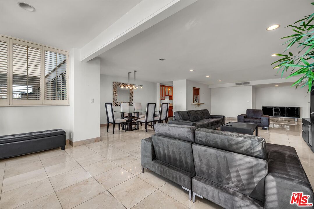 865 Comstock Avenue, Unit 4C Los Angeles, CA 90024 - Photo 10 of 26 a living room with furniture and a window