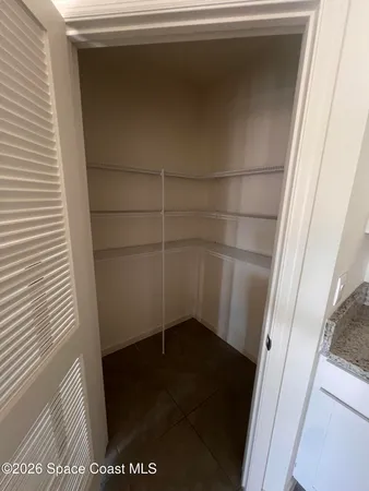 a kitchen with stainless steel appliances a sink a stove a microwave a sink a refrigerator and cabinets