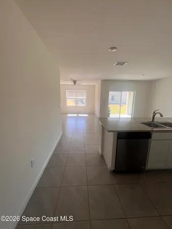 a bathroom with a granite countertop sink a toilet and bathtub