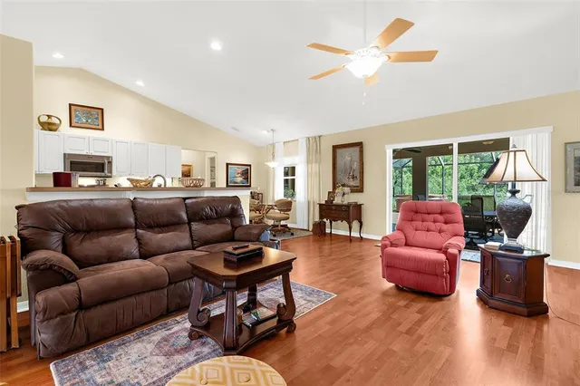 a living room with furniture or couch and a large window
