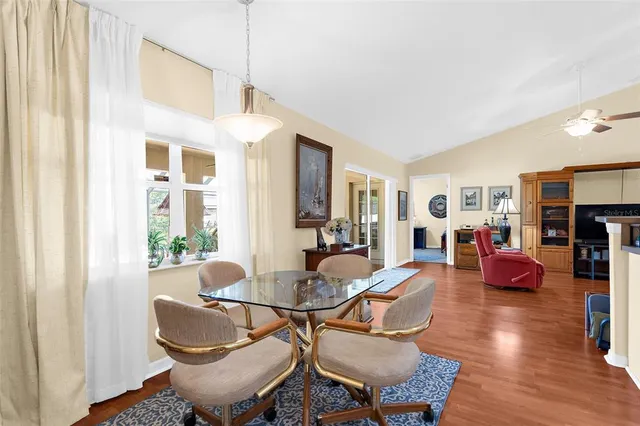 a living room with furniture a fireplace and wooden floor