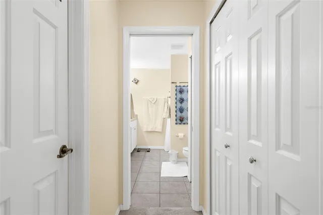 a bathroom with a glass shower door