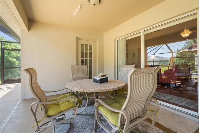 a view of a dining room with furniture and window