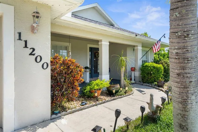 front view of a house with potted plants